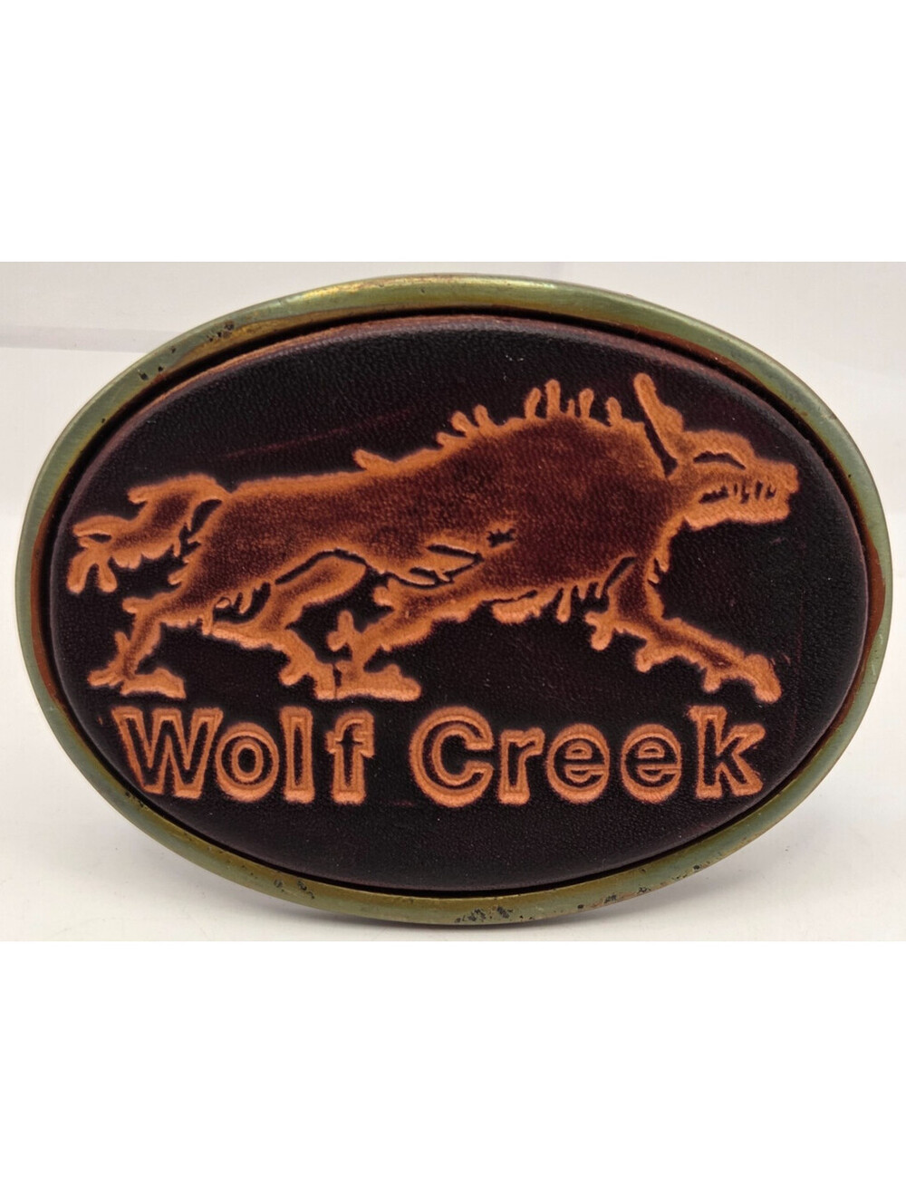Vintage Wolf Creek Donkey Leather Belt Buckle Western Brass Tone Oval 3.5 Inch